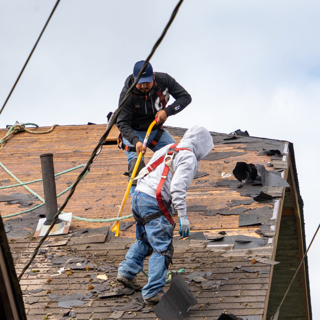 Everett WA. USA - 03-23-2021: Old Shingle Roof Being Removed